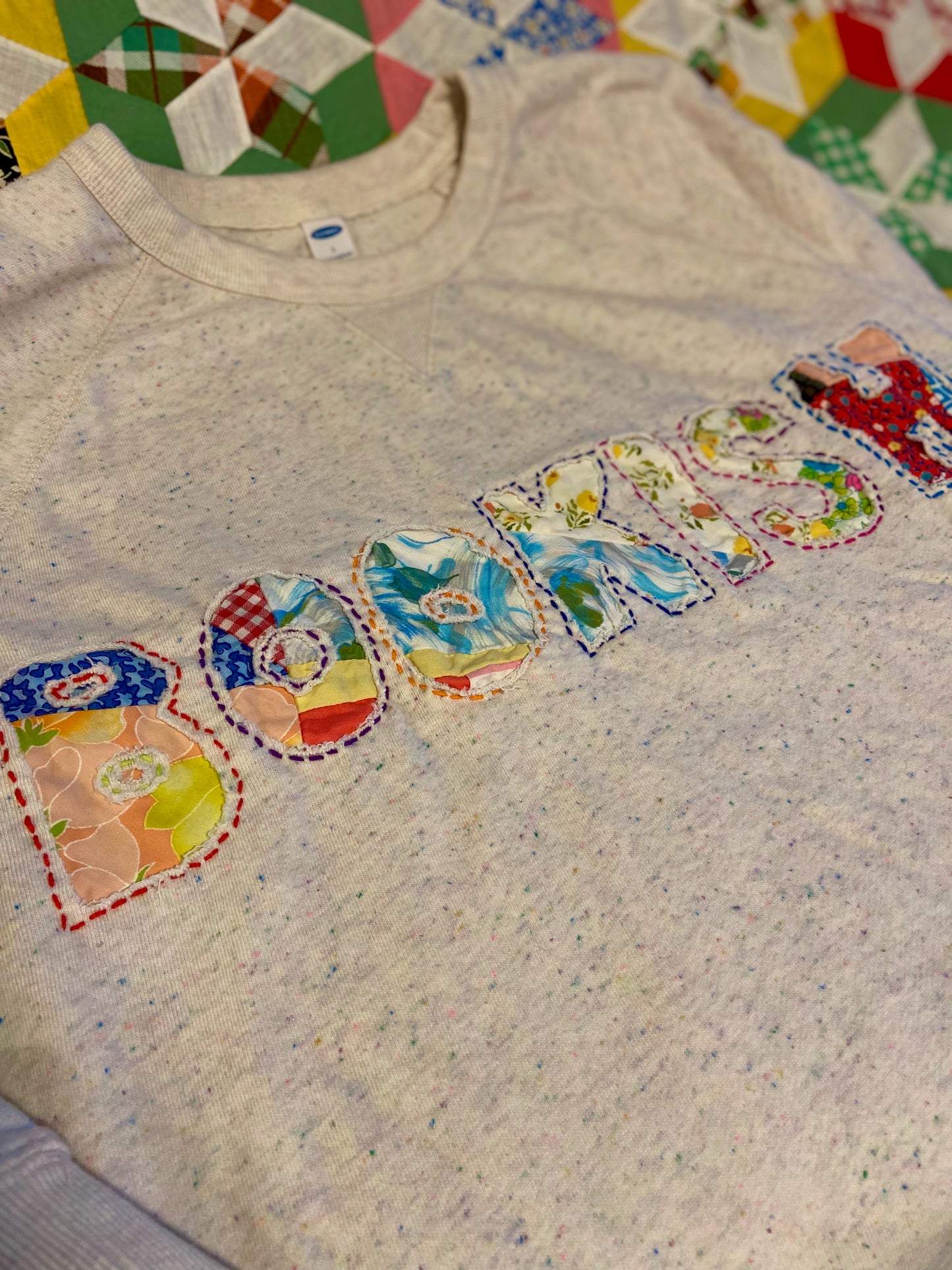 Bookish reverse appliqué sweatshirt